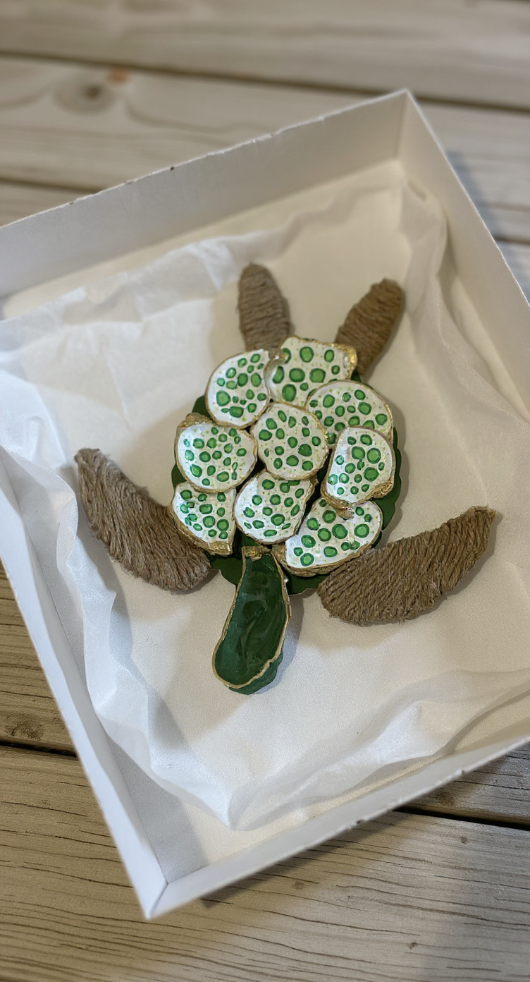 AI lifestyle image of The Gilded Loggerhead Sea Glass Edition in a gift box with tissue — handcrafted coastal sea turtle art, perfect coastal gift by The Golden Shoreline