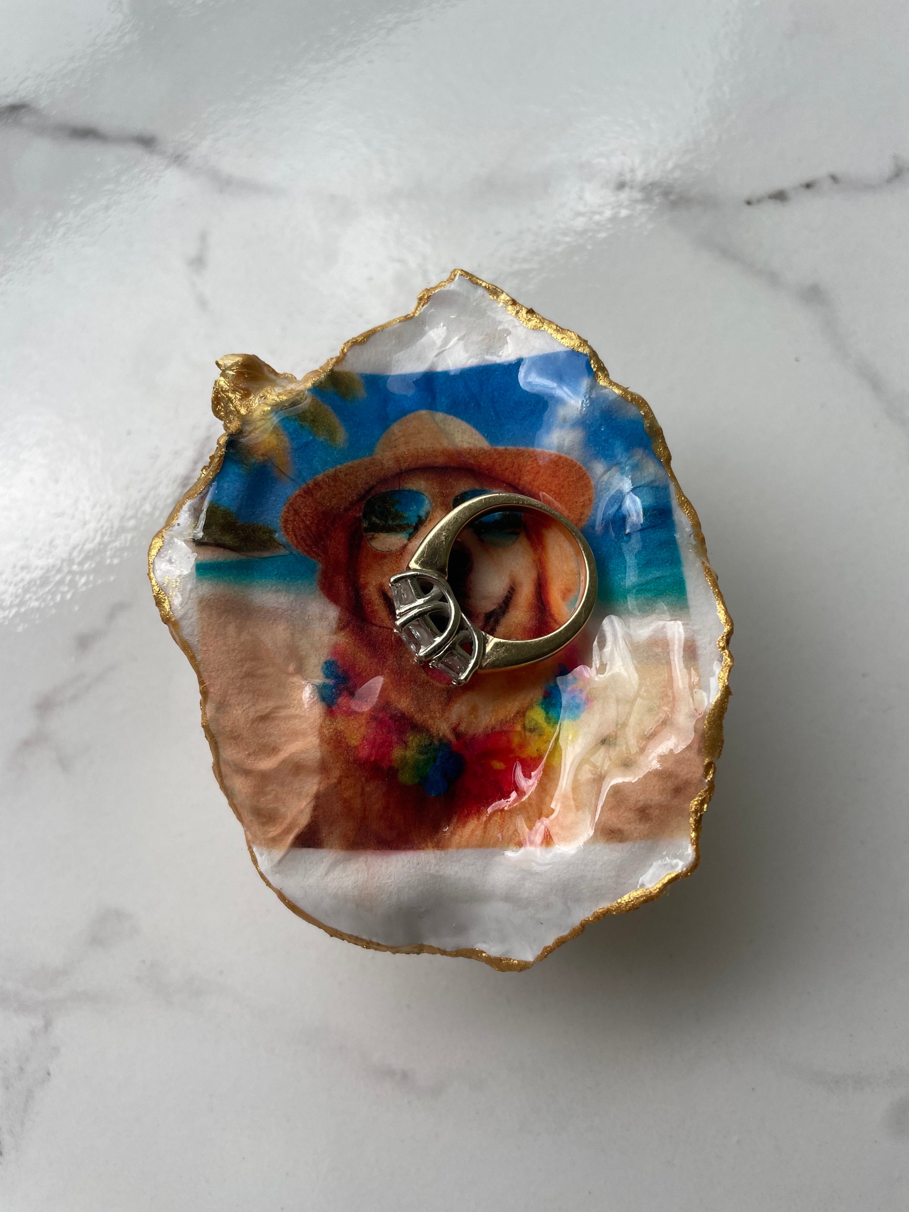 Gilded oyster shell trinket dish shown with a ring inside to show size — handcrafted coastal jewelry dish by The Golden Shoreline