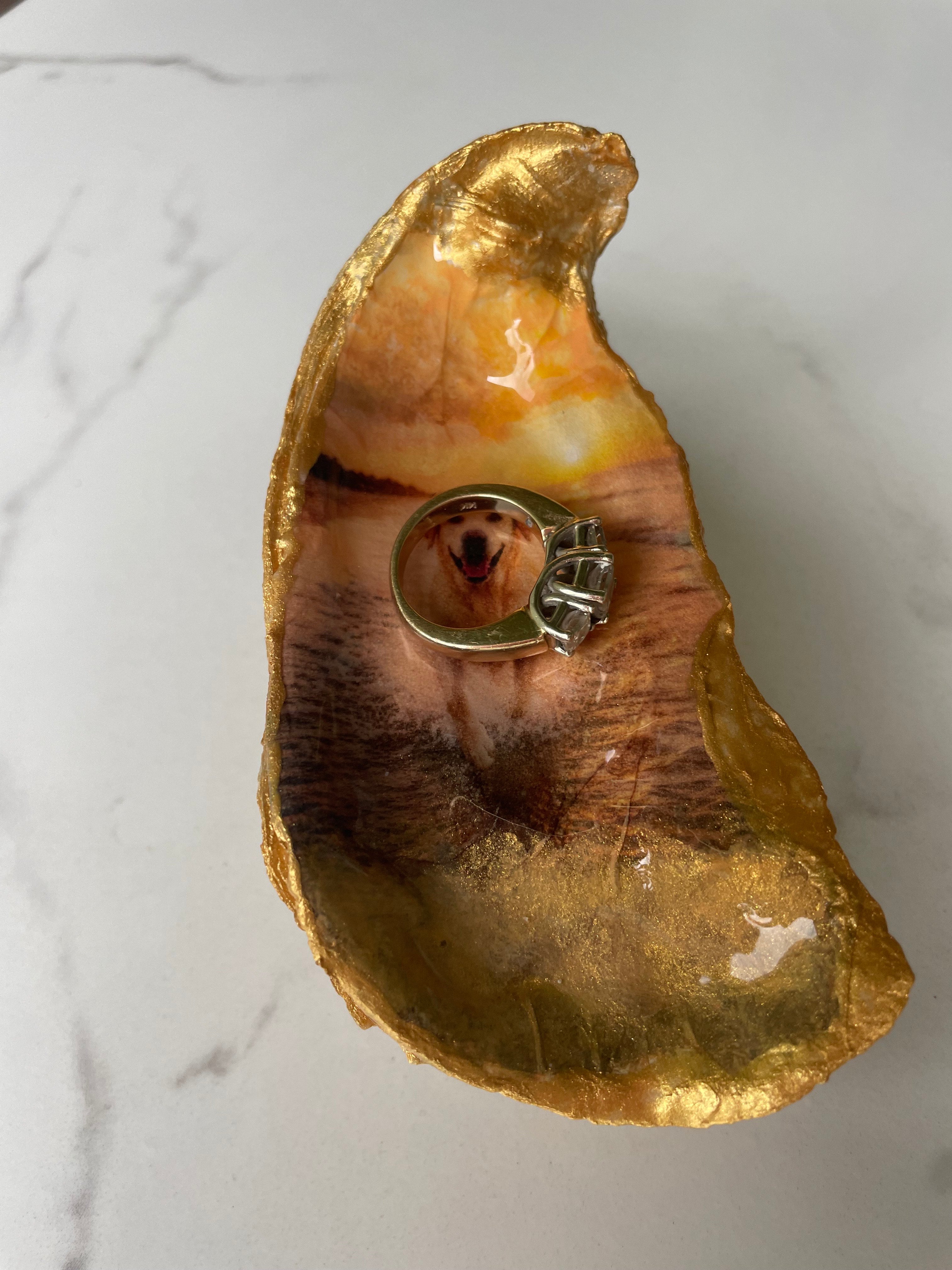 Gilded oyster shell trinket dish shown with a ring inside to show size — handcrafted coastal jewelry dish by The Golden Shoreline