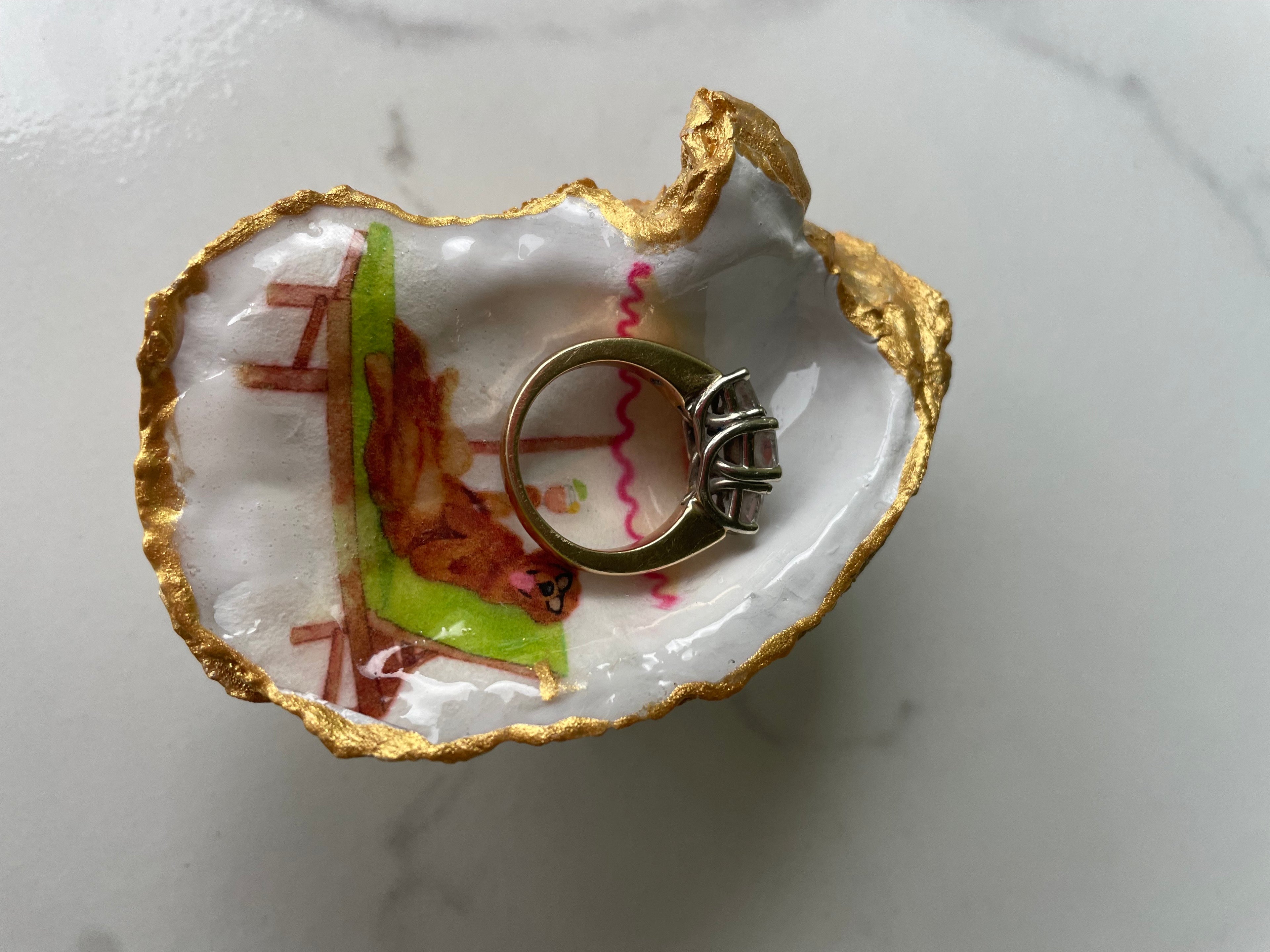 Labrador Paradise gilded oyster shell trinket dish shown with a ring inside to show size — handcrafted coastal jewelry dish by The Golden Shoreline
