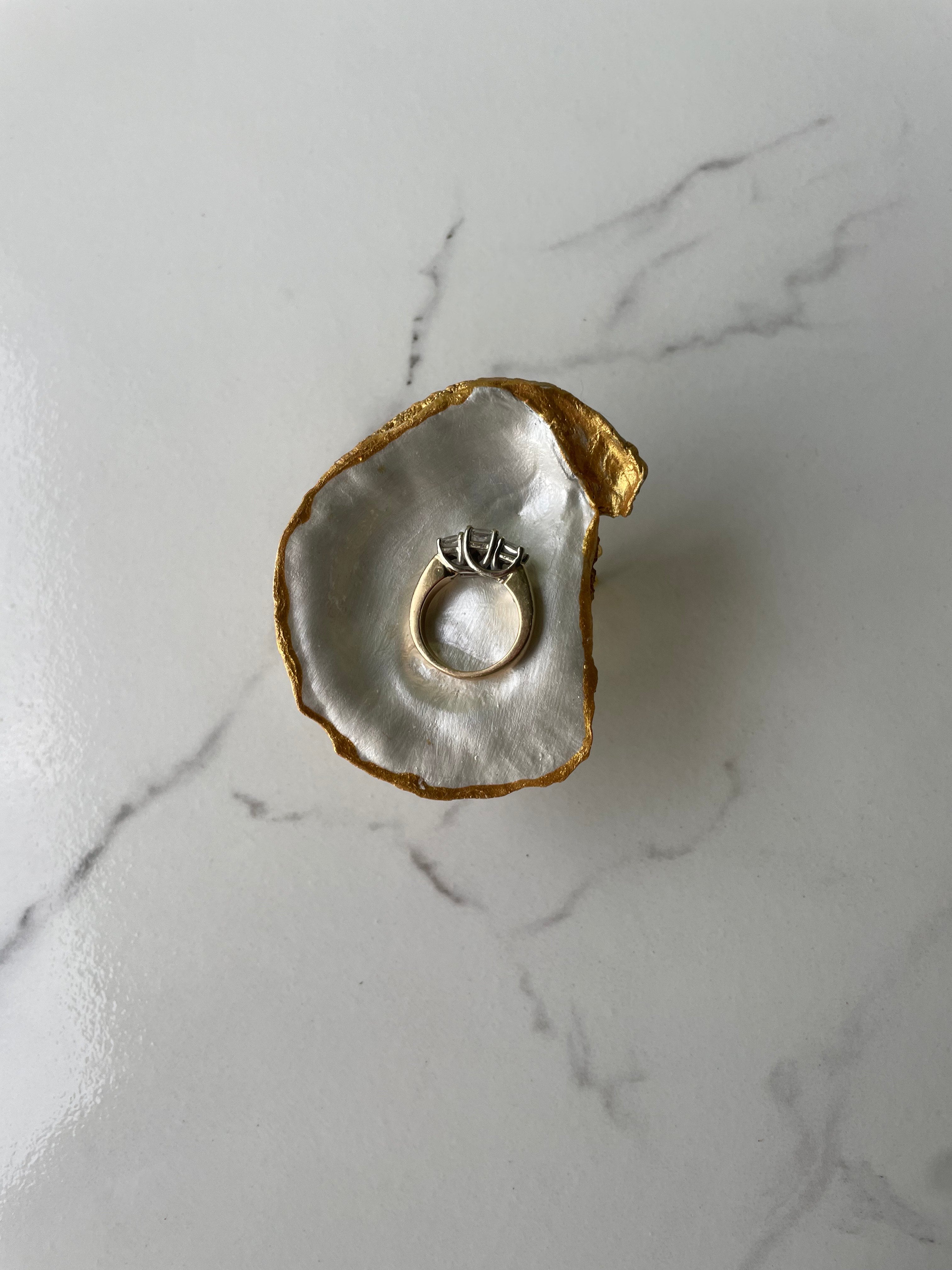 Pearlie gilded oyster shell trinket dish shown with ring to display size