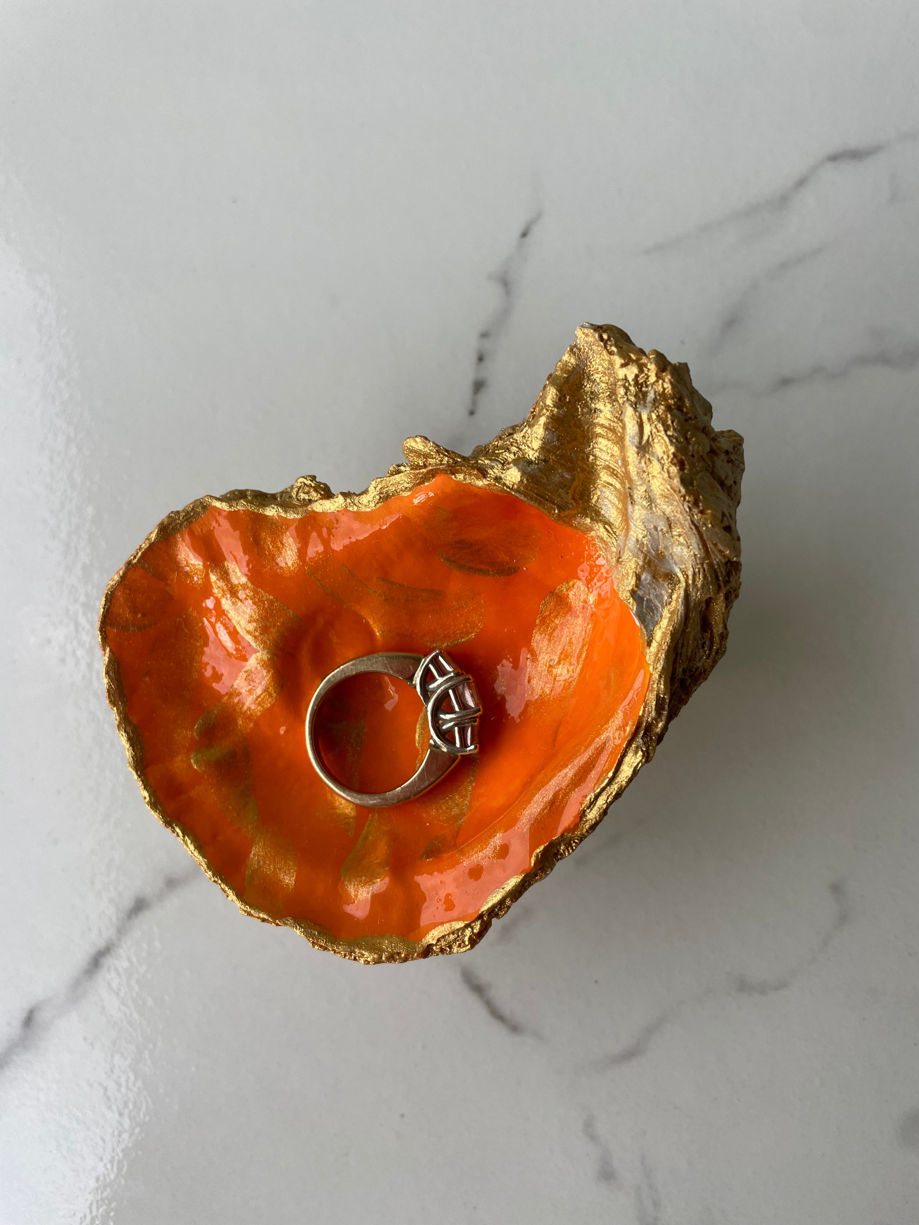 Sunkissed gilded oyster shell trinket dish shown with ring to display size