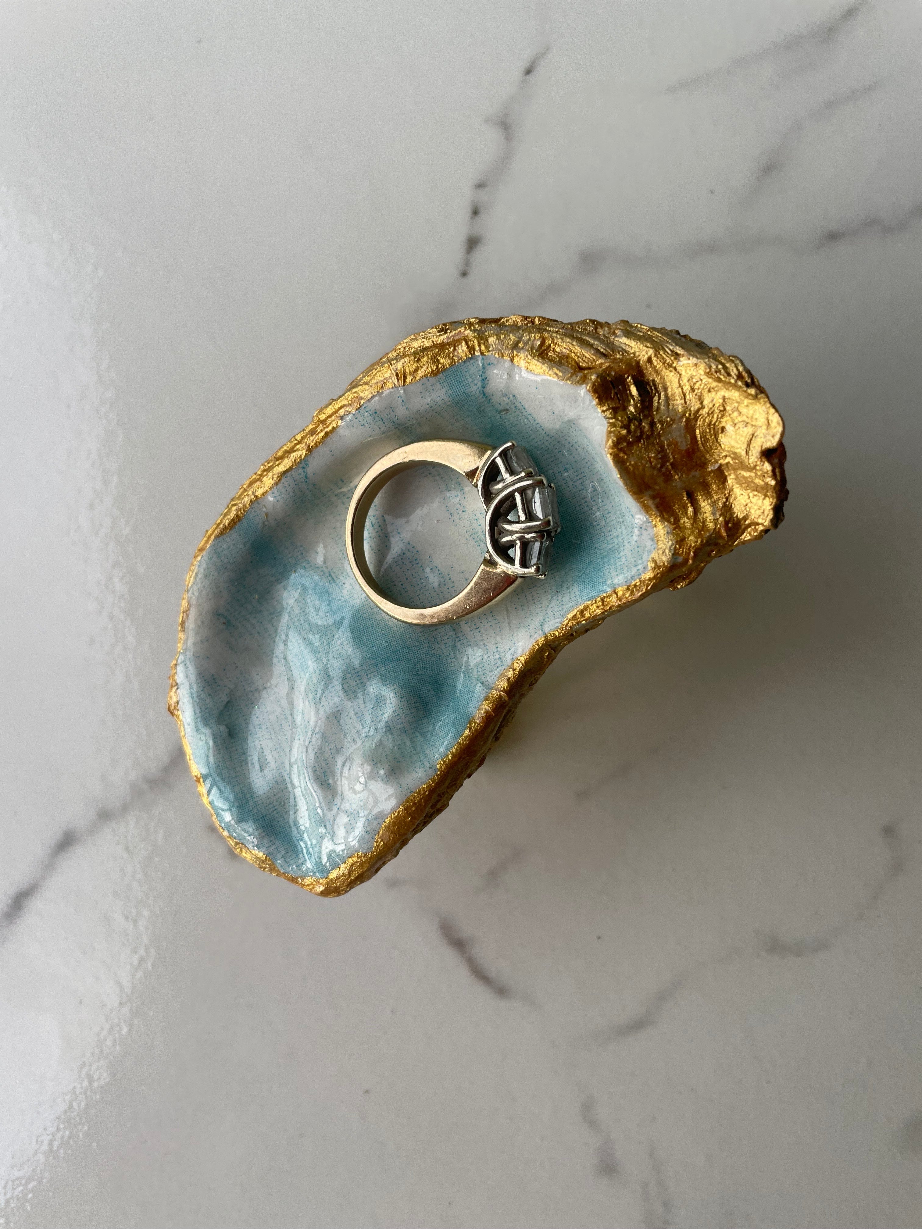 Curio gilded oyster shell trinket dish shown with ring to display size