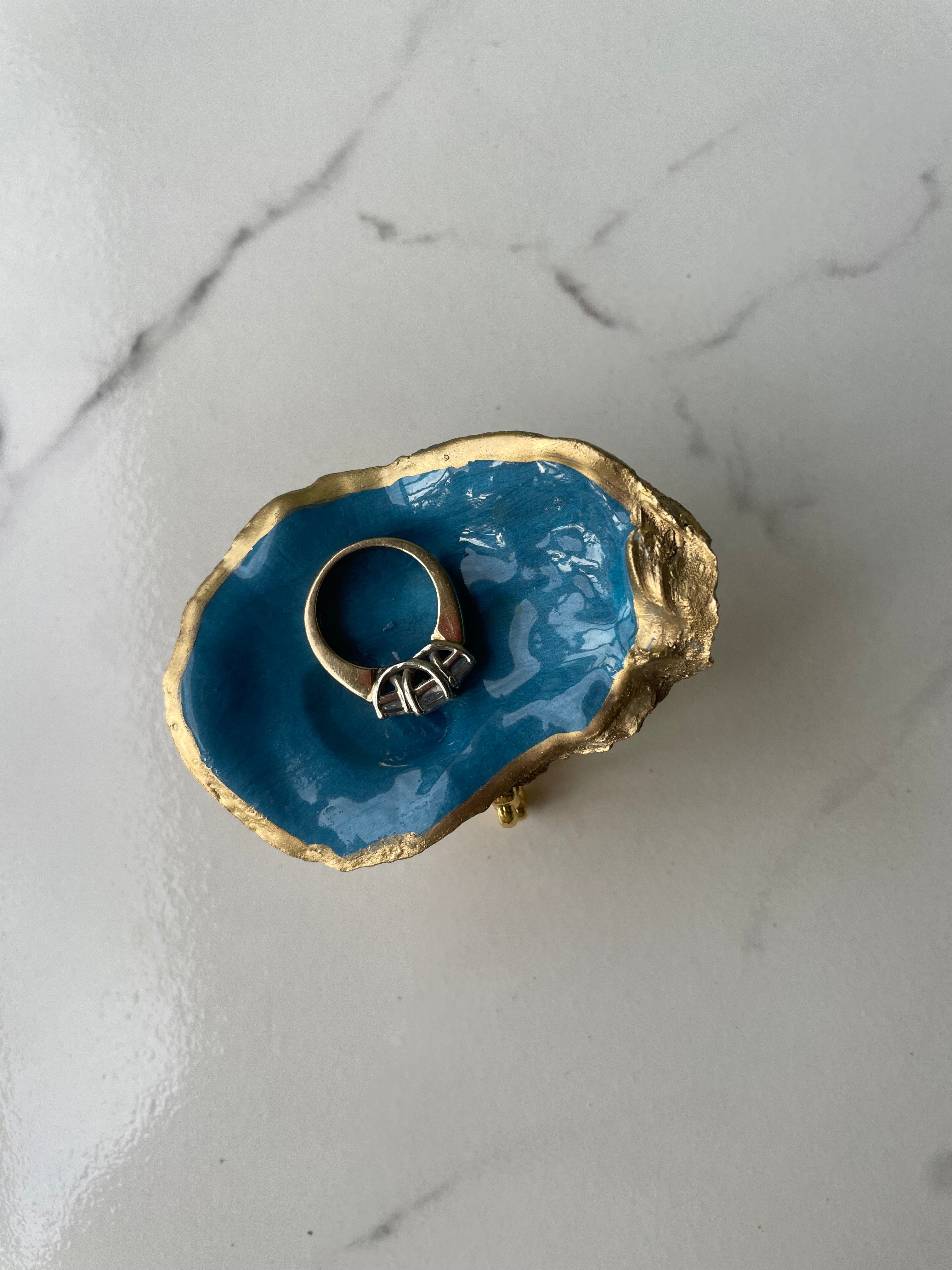 Midnight Tide gilded oyster shell trinket dish shown with ring to display size