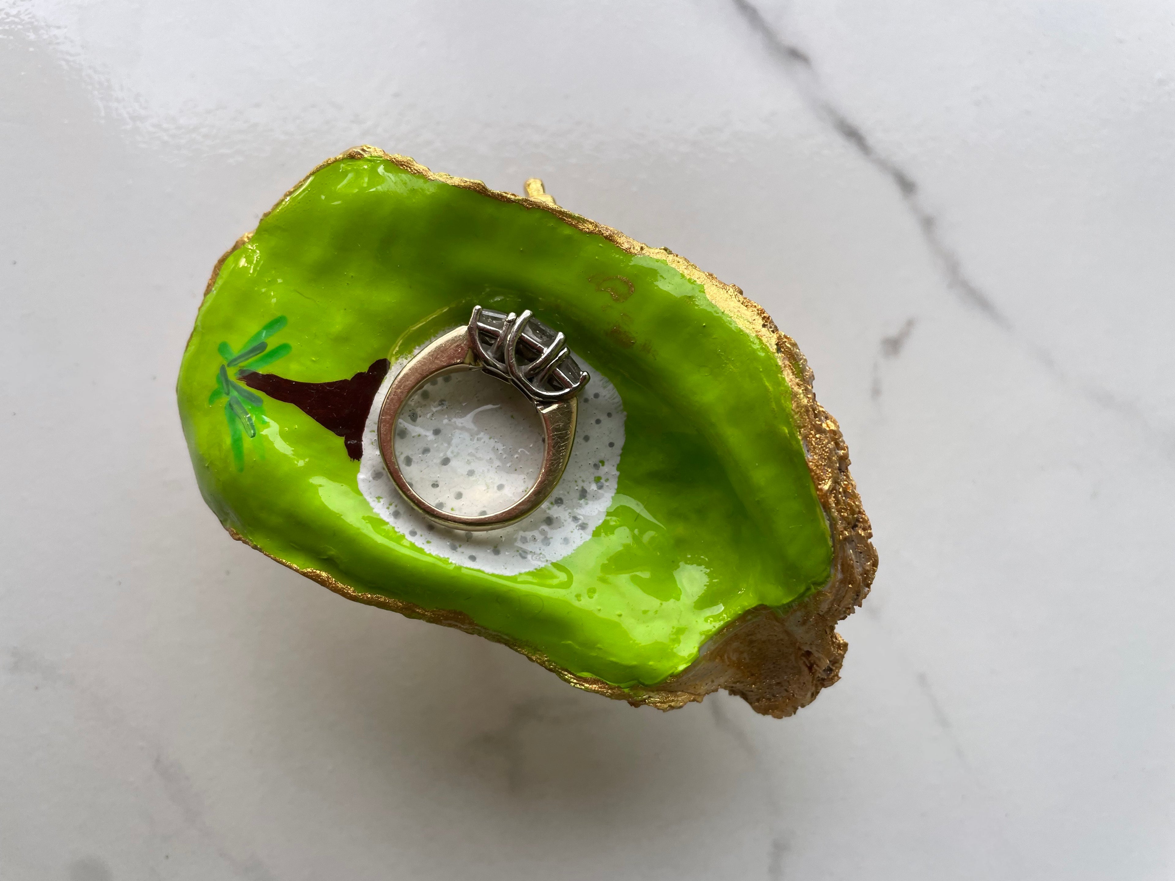 The 19th Hole Keepsake Tee Off Edition gilded oyster shell trinket dish shown with ring to display size