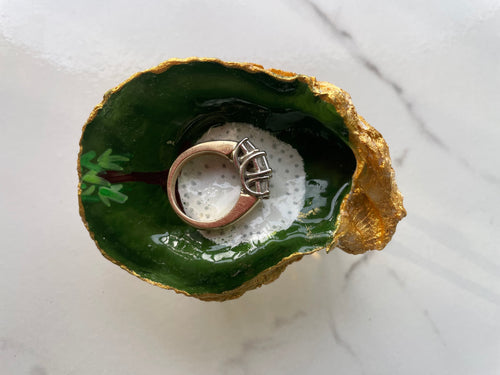 The 19th Hole Keepsake Emerald Green Edition gilded oyster shell trinket dish shown with ring to display size