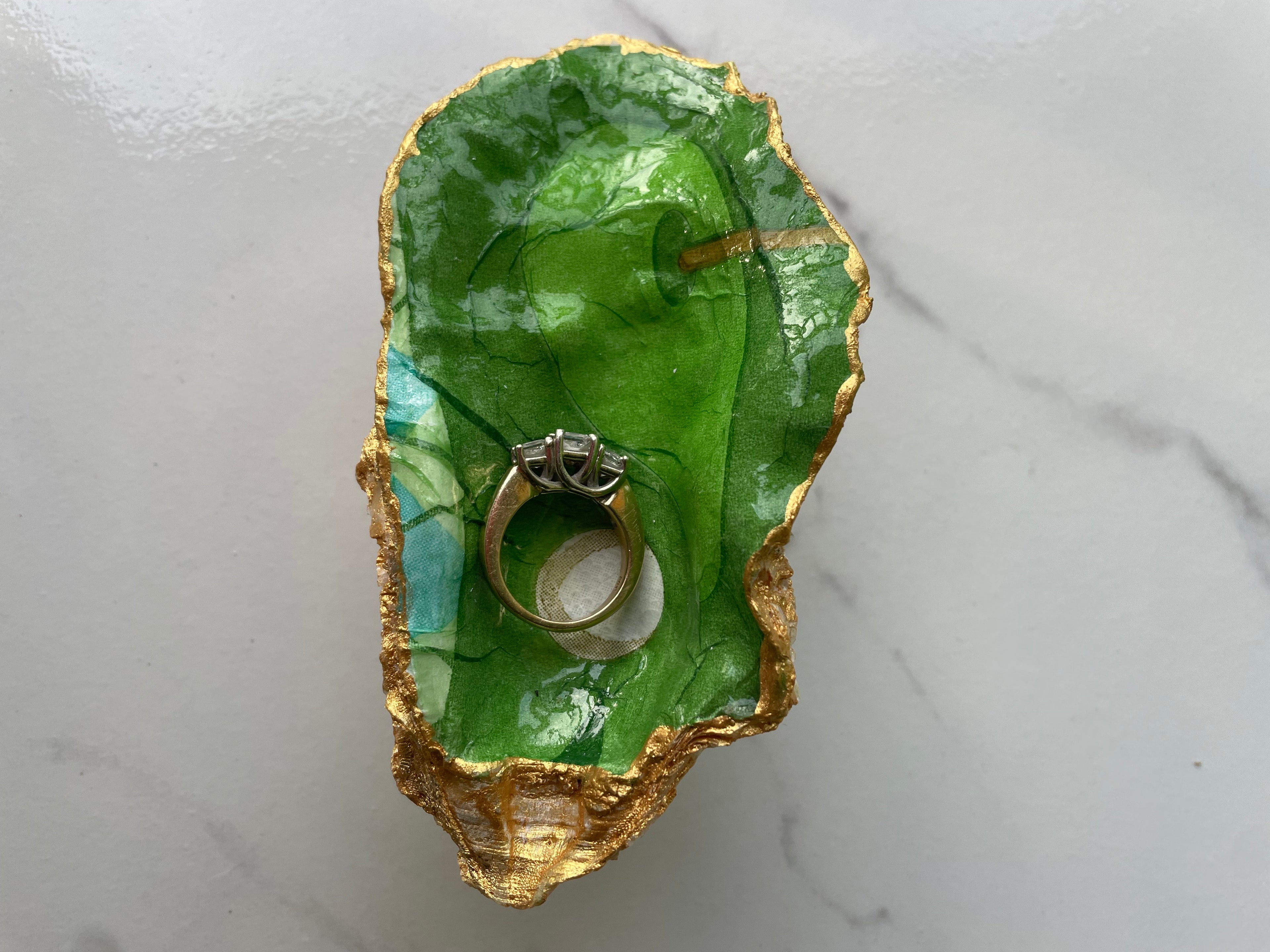 The 19th Hole Keepsake Green in Play Edition gilded oyster shell trinket dish shown with ring to display size