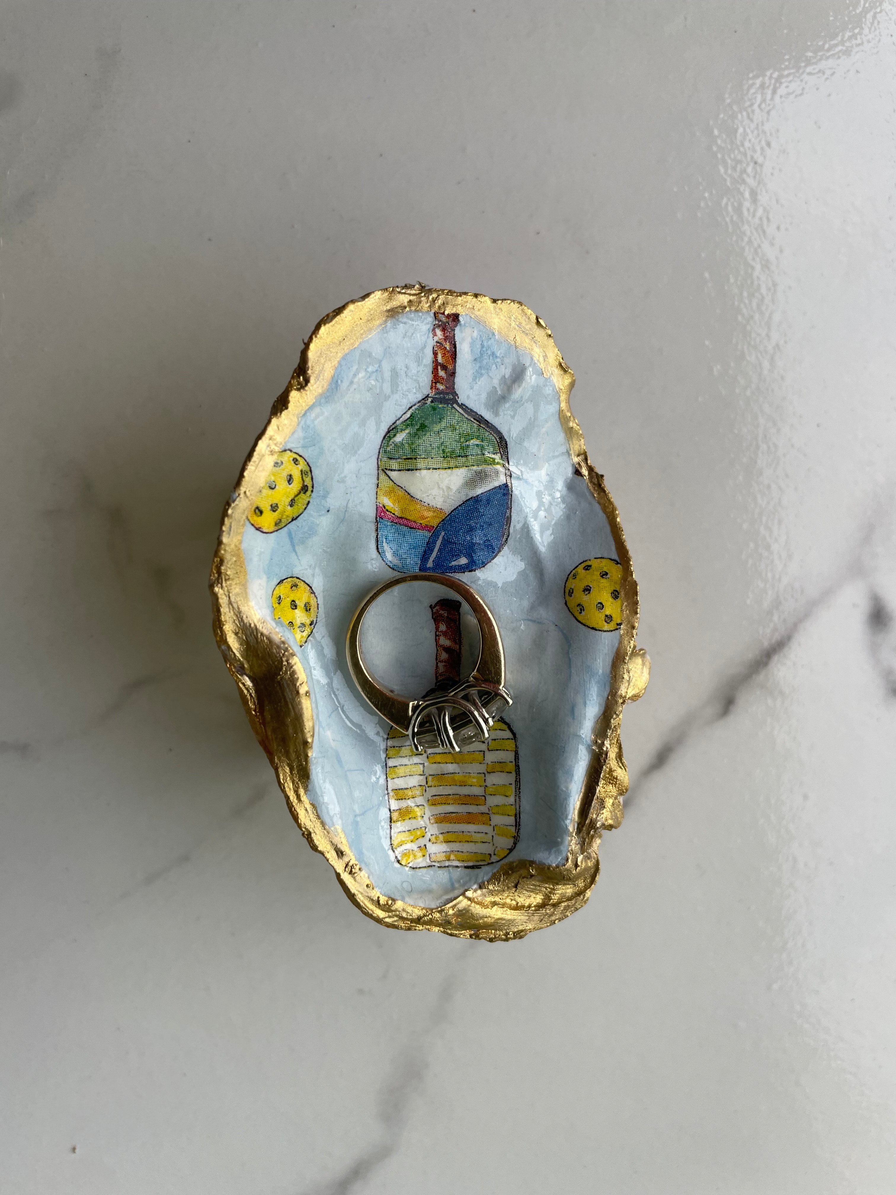 Pickleball Rally gilded oyster shell trinket dish shown with ring to display size