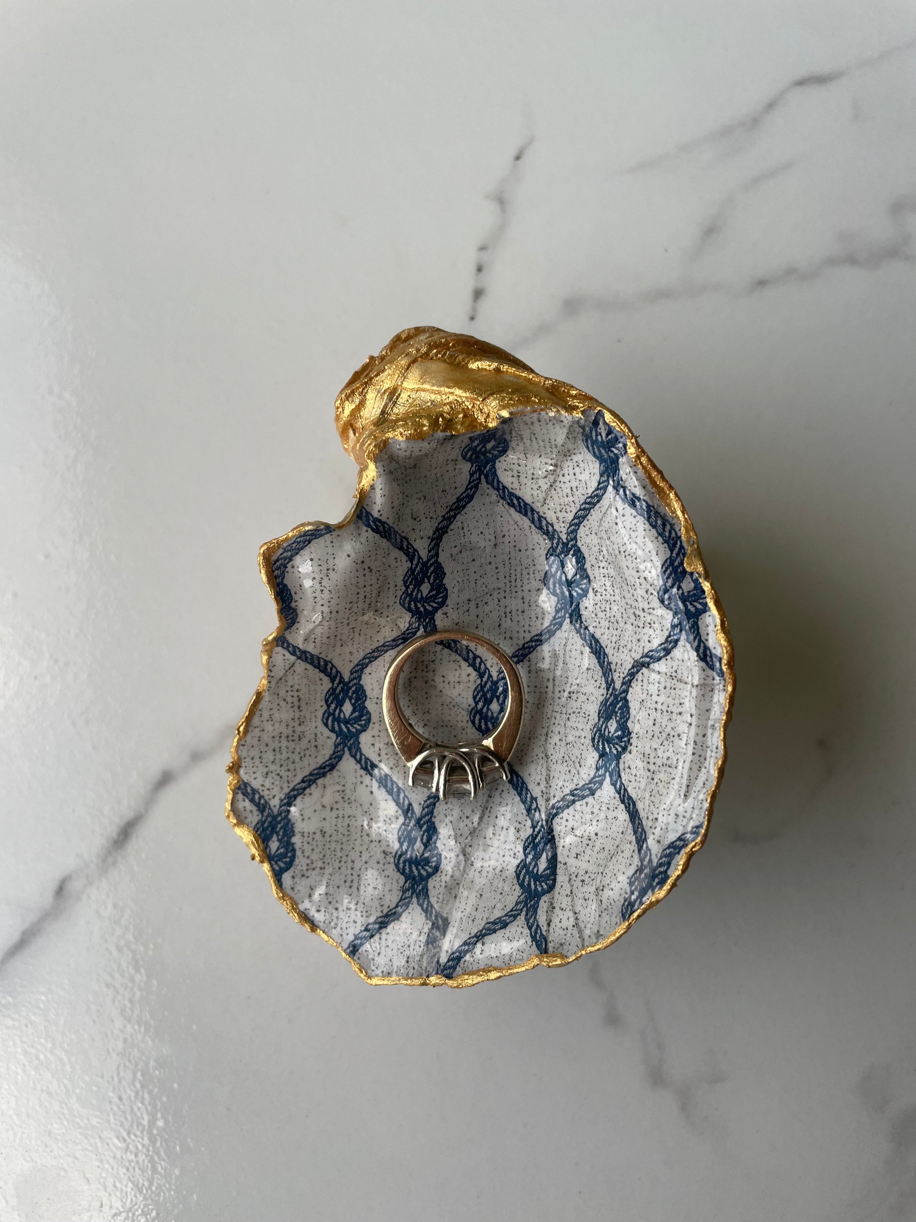 Nautical Net gilded oyster shell trinket dish shown with ring to display size