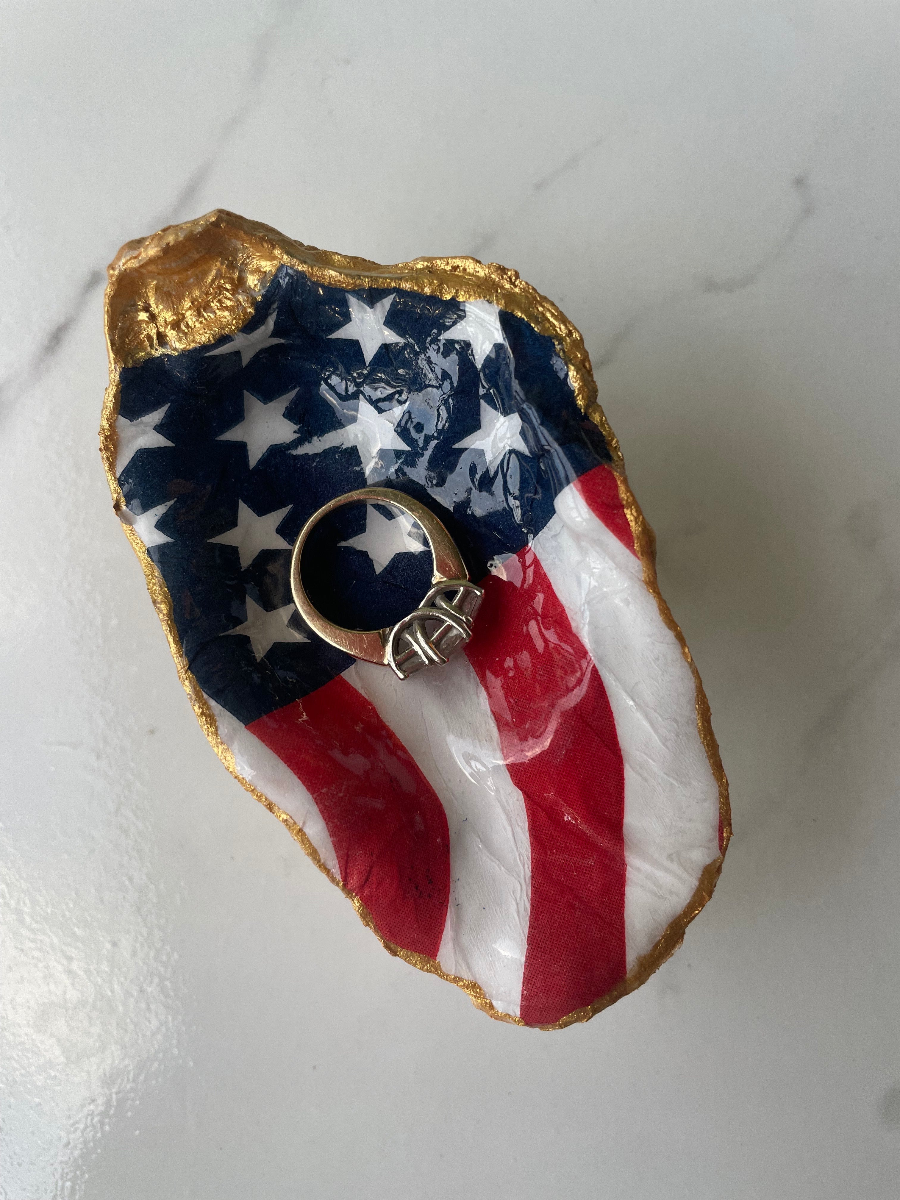Old Glory gilded oyster shell trinket dish shown with ring to display size