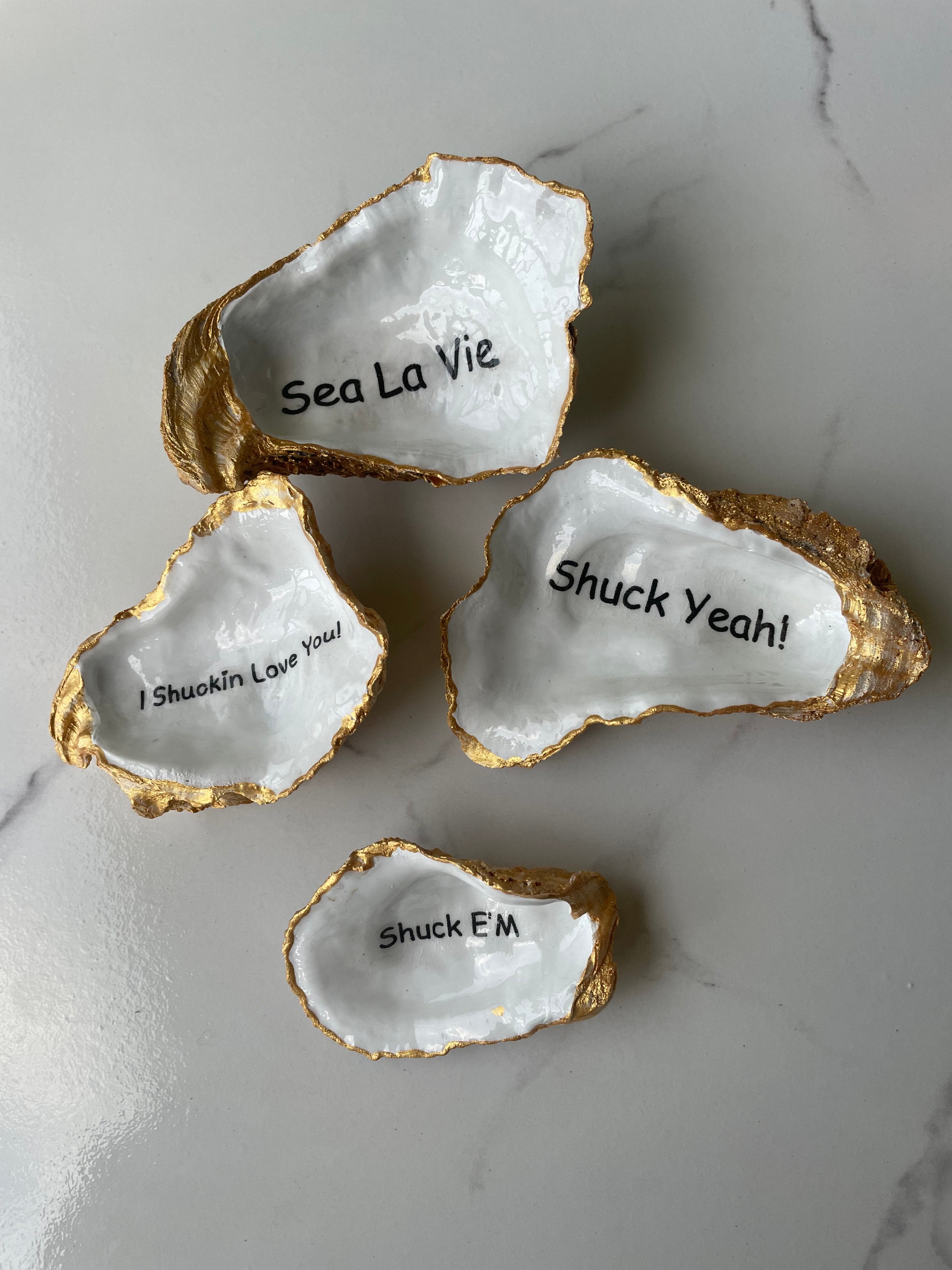Shore Talk gilded oyster shell trinket dish collection — four styles displayed together