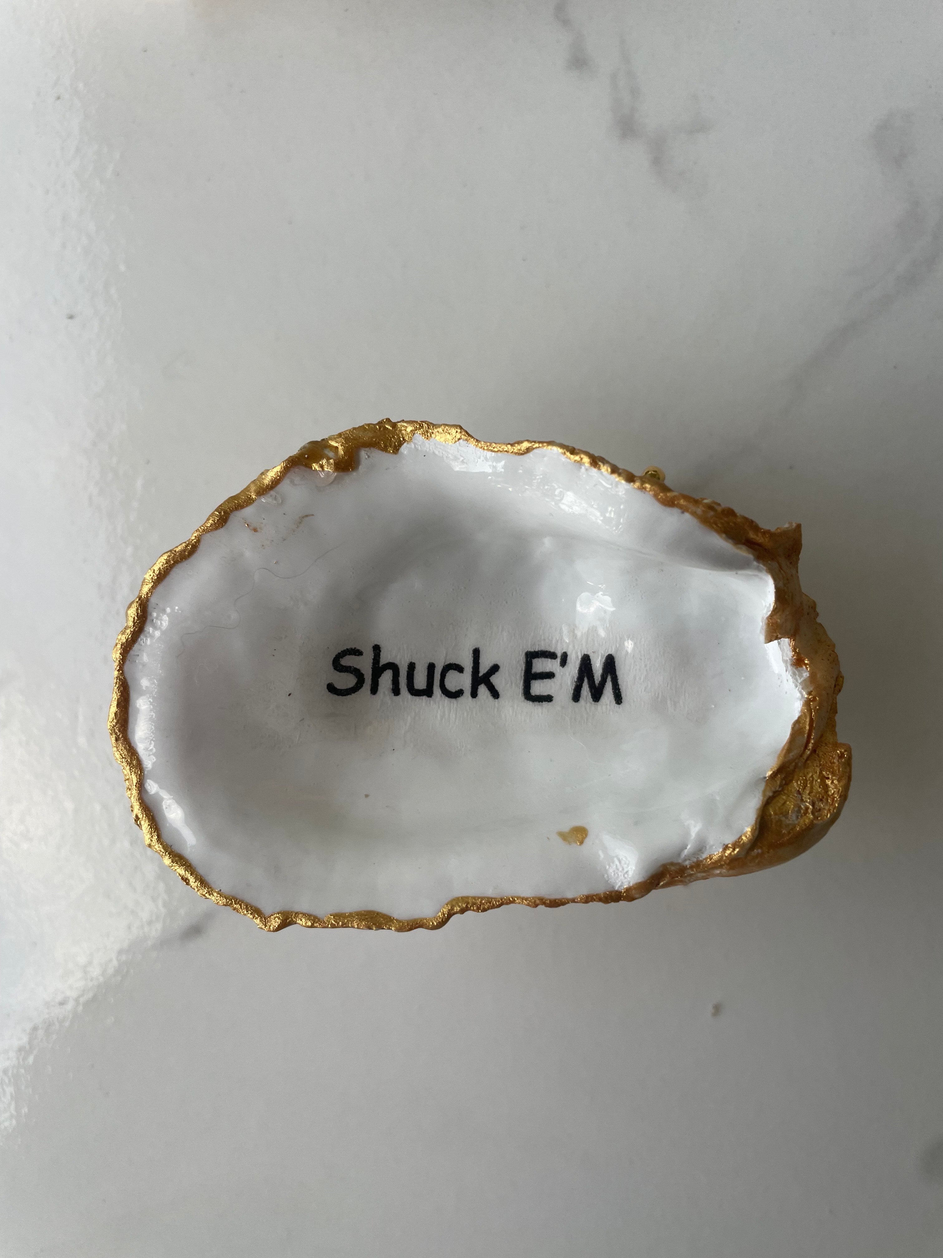 Shore Talk gilded oyster shell trinket dish shown with ring to display size