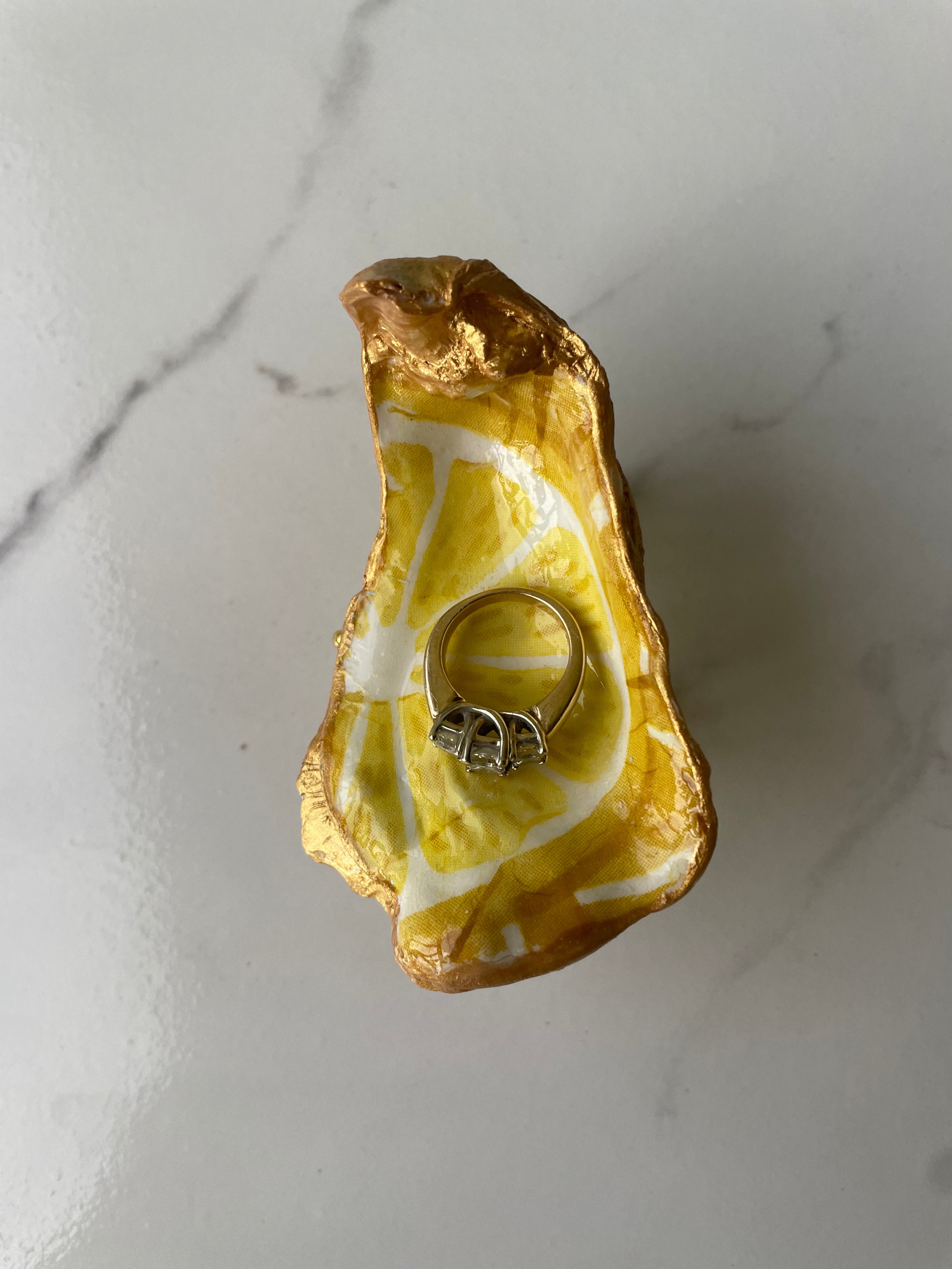 Lemon Zest gilded oyster shell trinket dish shown with ring to display size
