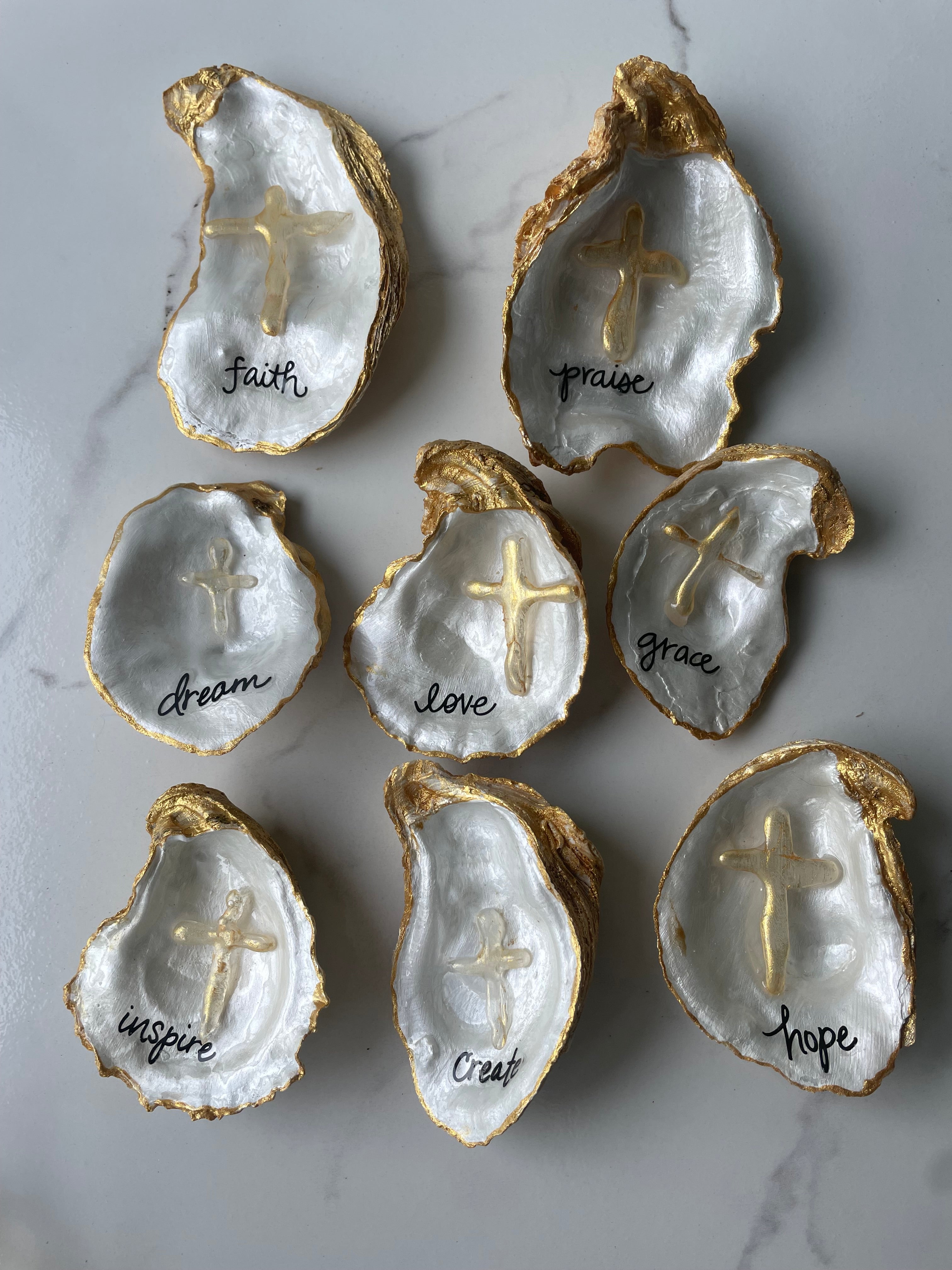 The Inspiration Series gilded oyster shell trinket dishes — collection of word art designs with dimensional gold cross accent and gold paint edging by The Golden Shoreline