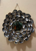 "Handcrafted mussel shell wreath with gold paint edges in deep charcoal, pearl, and midnight-blue tones — Midnight Tide by The Golden Shoreline"
