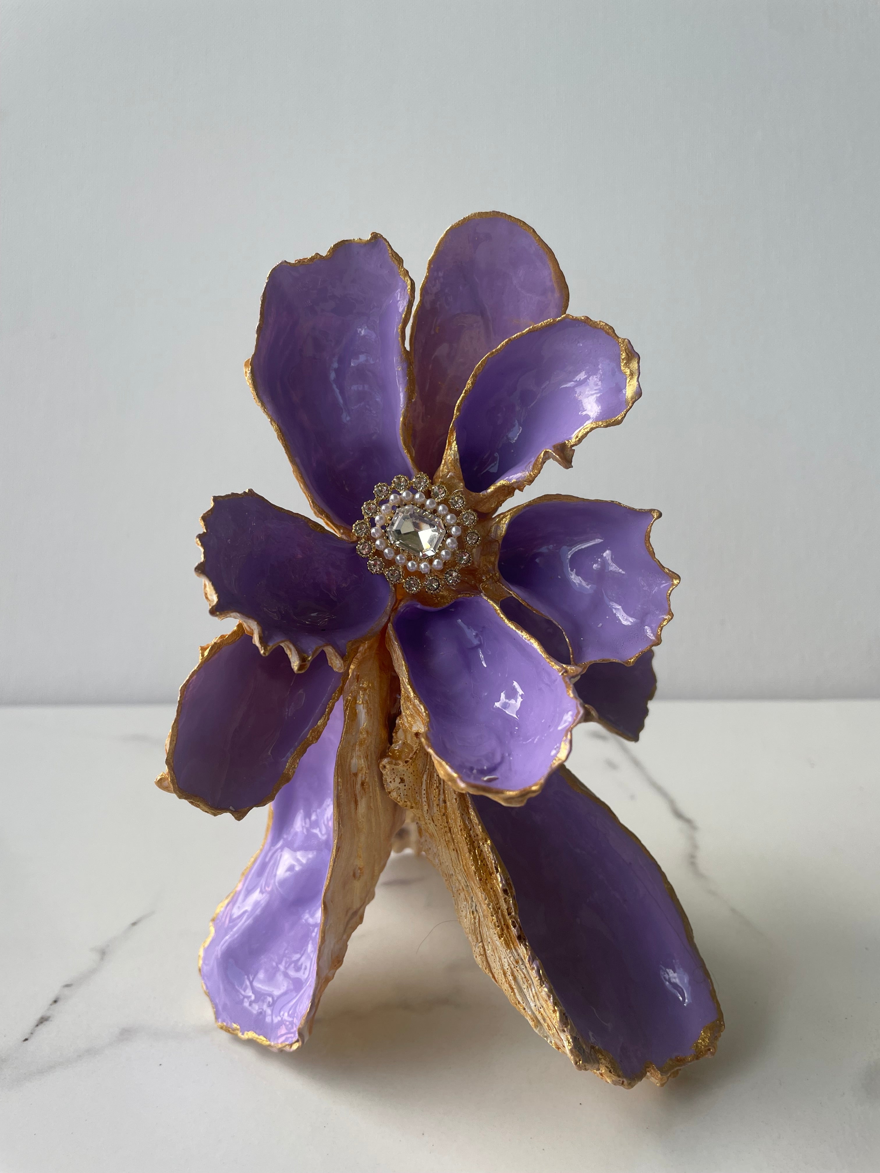 Gilded Iris Shell Flower sculpture #1 — hand-crafted oyster shell petals in violet and lavender with gold paint edges and pearl bead center by The Golden Shoreline