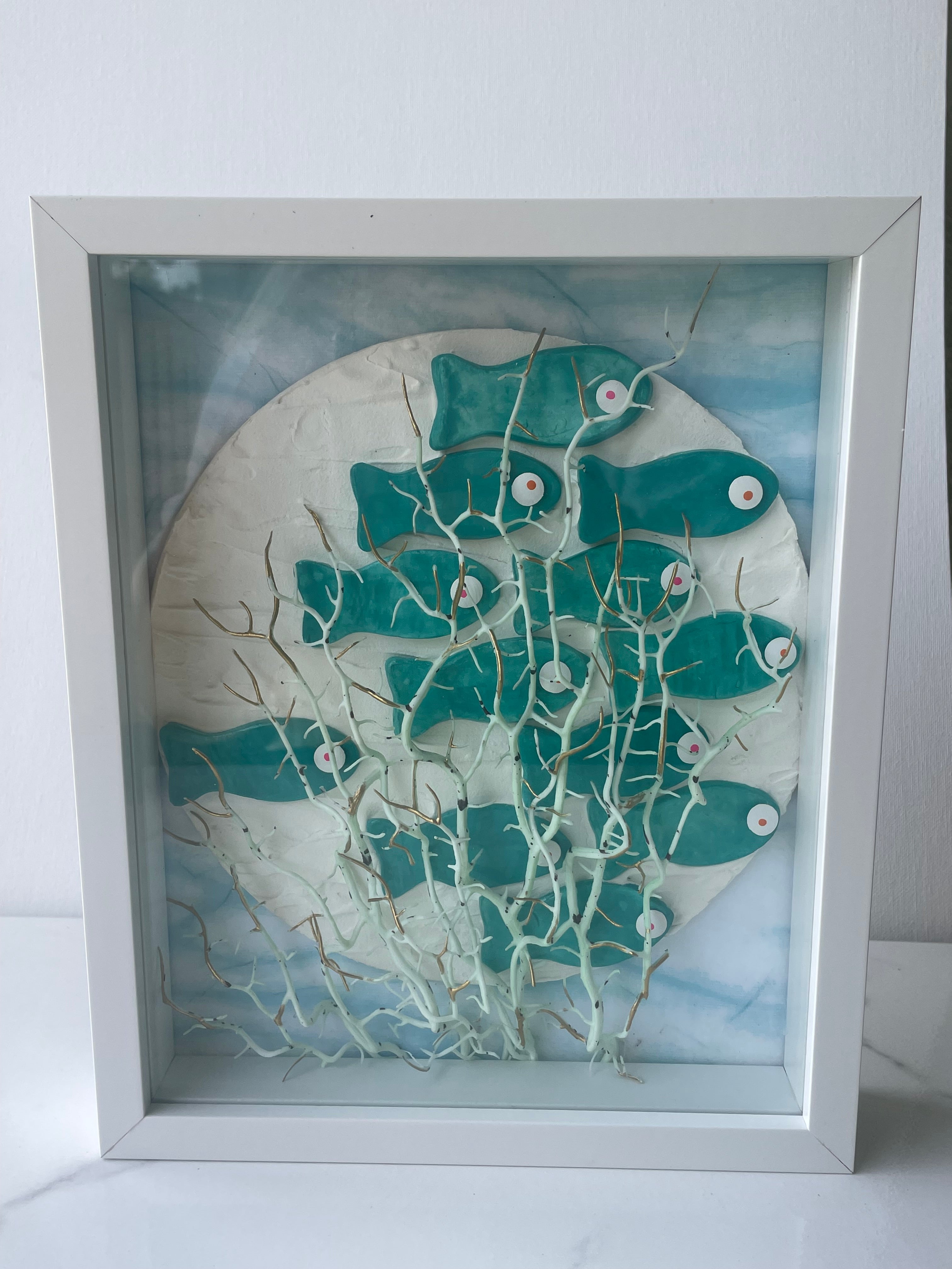The Reef Reverie Shadow Box — front view of handcrafted white shadowbox with clay fish and coastal ocean scene by The Golden Shoreline