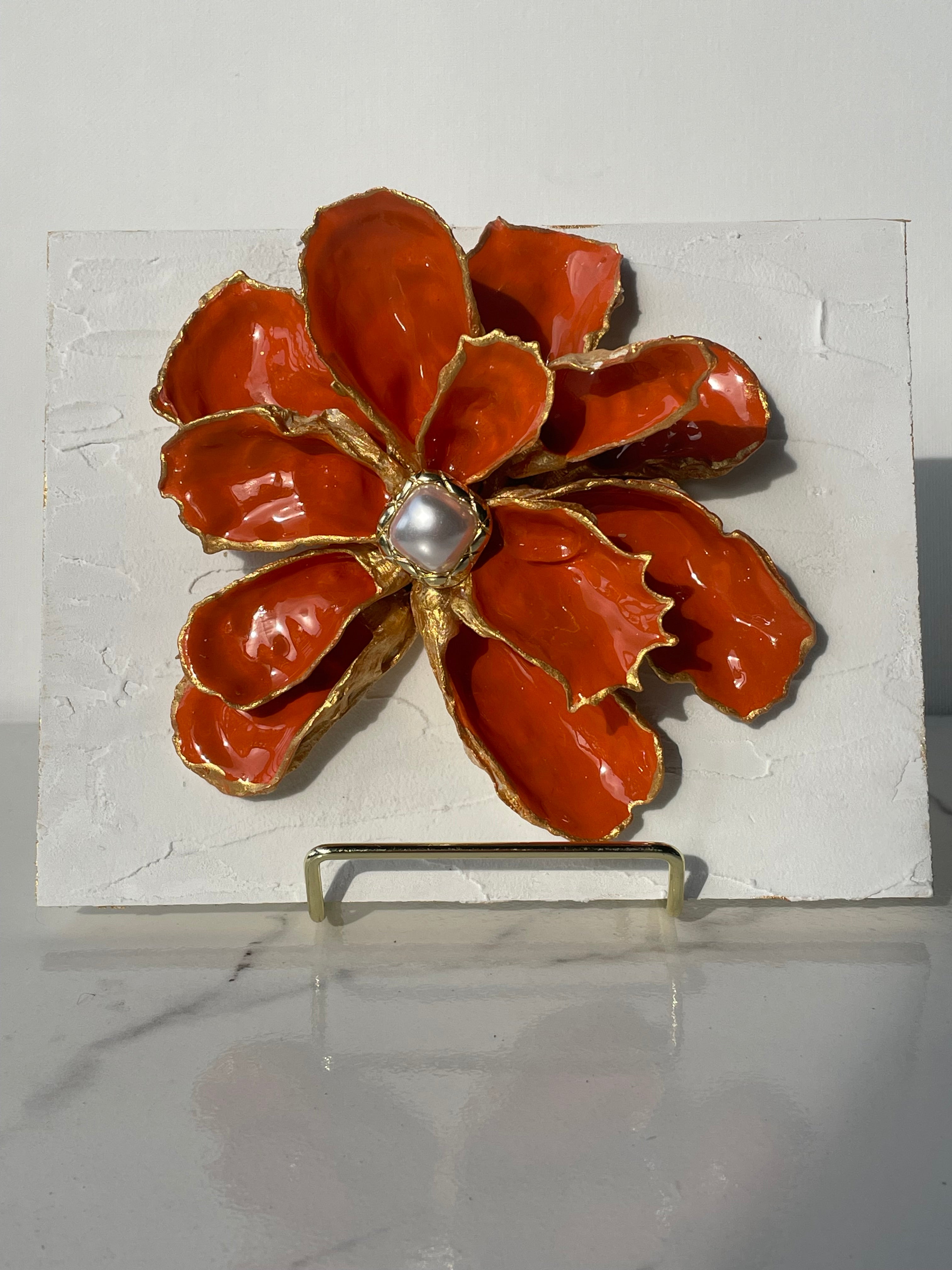 Handcrafted oyster shell flower with coral finish, gold paint edges, and pearl center, mounted on a textured canvas board — The Golden Shoreline